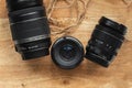 Professional camera lenses on the rustic wooden background. Flat lay. Mockup for photo or videomaker advertisement Royalty Free Stock Photo
