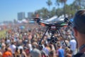 Professional filming an outdoor music festival with a flying camera drone