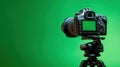 The professional camera set against a vibrant green backdrop for creative shoots. AI generated image Royalty Free Stock Photo
