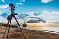 Camera on tripod and shipwreck