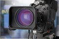 Professional video camera on dark background Royalty Free Stock Photo