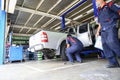 Professional car mechanic, tire change Royalty Free Stock Photo