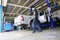 Professional car mechanic, tire change Royalty Free Stock Photo