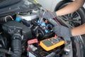 Car repair and maintenance. Performing engine diagnostics Royalty Free Stock Photo