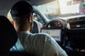 Car mechanic working in auto repair service using laptop Royalty Free Stock Photo