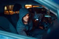 Professional car thief with flashlight, Royalty Free Stock Photo