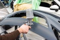 Professional car varnisher at work in a service station - Serie car repair workshop Royalty Free Stock Photo