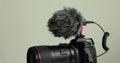 Professional cardioid directional black video condenser microphone attaches to camera