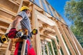 Professional Carpenter Construction Worker in Yellow Hard Hat