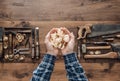 Carpenter holding wood shavings