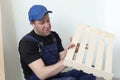 Professional carpenter. Wooden slats and working tools. Production of wood products