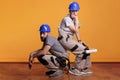 Professional carpenters holding construction tools Royalty Free Stock Photo