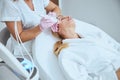 Blonde woman getting a skin tightening treatment