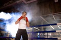 Professional female fighter in ring Royalty Free Stock Photo