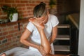 professional female physiotherapist masseuse performing leg massage to hispanic woman in spa clinic