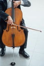Professional cellist playing his instrument