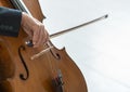 Professional cellist playing his instrument