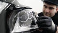 Professional ceramics handler apply different layers to the car using an applicator sponge, fiber immediately checking the effec