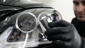 Professional ceramics handler apply different layers to the car using an applicator sponge, fiber immediately checking the effec