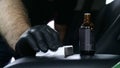 Professional ceramics handler apply different layers to the car using an applicator sponge, fiber immediately checking the effec