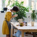 Artisan ceramist woman record master class for pottery online video courses in workshop making jug