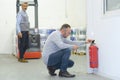 professional checking fire extinguisher Royalty Free Stock Photo