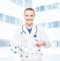 A professional and cheerful doctor woman with a tablet