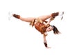 professional cheerleader dressed in a warrior costume standing on one hand. Horizontal splits