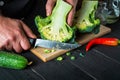 Professional chef is cutting cauliflower in a restaurant kitchen. The idea of a delicious diet for breakfast or dinner Royalty Free Stock Photo
