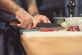 Professional chef cutting meat in the kitchen Royalty Free Stock Photo