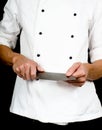 Professional chef holding a sharp cooking knife Royalty Free Stock Photo