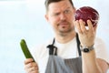 Professional Chef Holding Whole Purple Cabbage