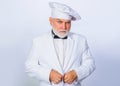 Professional chef man in white uniform. Cooking concept. Bearded cook or baker. Royalty Free Stock Photo