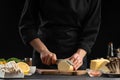 A professional chef prepares a fresh and healthy Italian salad slicing mazzarella cheese, Organic and wholesome food. Healthy