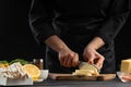 A professional chef prepares a fresh and healthy Italian salad slicing mazzarella cheese, Organic and wholesome food. Healthy