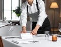 Professional Chef Preparing Table Setting in Restaurant Royalty Free Stock Photo