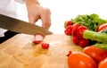 Professional chef slicing radish Royalty Free Stock Photo