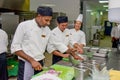 Professional chef cutting onion at the kitchen of the restaurants