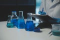 professional chemist woman laboratory using scientific microscope for science research, chemistry scientist with microbiology Royalty Free Stock Photo