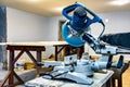 A professional circular saw with a miter in the woodcraft carpentry workshop. Royalty Free Stock Photo