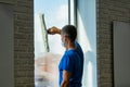 Professional cleaner cleans the window photo Royalty Free Stock Photo