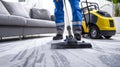 Professional cleaning service using a high-powered vacuum cleaner on a carpet in a modern home setting. Commercial Royalty Free Stock Photo