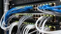 Network Switch in Data Center with Colorful Ethernet Cables and Glowing LED Status Lights Royalty Free Stock Photo