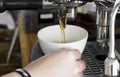 Professional coffee machine making espresso in a cafe, close-up Royalty Free Stock Photo