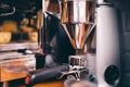 Professional coffee milling machinery preparing for espresso making Royalty Free Stock Photo