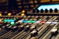 a professional concert mixing console with faders is used by a DJ for recording music. Close-up Royalty Free Stock Photo