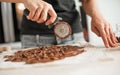 Professional confectioner making tasty cake with melted chocolate Royalty Free Stock Photo