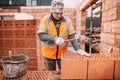 Professional construction worker, bricklayer and mason building house Royalty Free Stock Photo