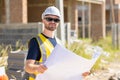 Professional construction worker engineer male. Real estate house project builder. Smart architect man standing work in Royalty Free Stock Photo