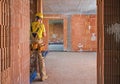 Professional Construction Worker Inside Brick Built Building